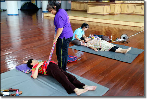 Massage session in a Chinese temple in Hat Yai, Thailand