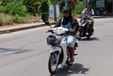 Passing motorcyclists, Nakhon Sri Thammarat, Thailand - Click for larger image