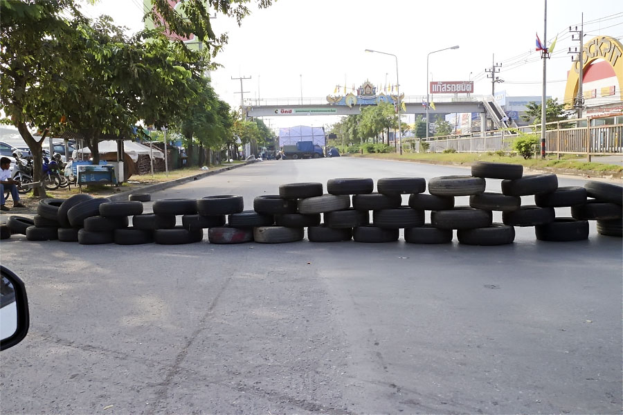 Government protesters blocking a major road last year