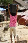 Burmese child carrying water - Click for larger image