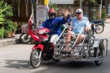 Disabled farang in a sidecar - Click for larger image