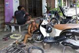 Motorbike repair man - Click for larger image