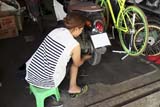 Motorcycle repair woman - Click for larger image