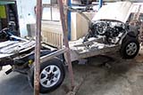 Wrecked pickup truck undergoing repair - Click for larger image