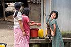 Burmese child pumping water - Click for larger image