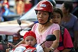 Young Thai child on a motorbike - Click for larger image